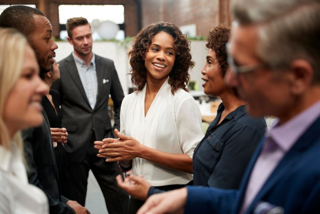 Flourishing Business Community: Diverse group of business people having a conversation